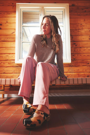 Caroline Cow Hair Clog on Model in Pink Pants